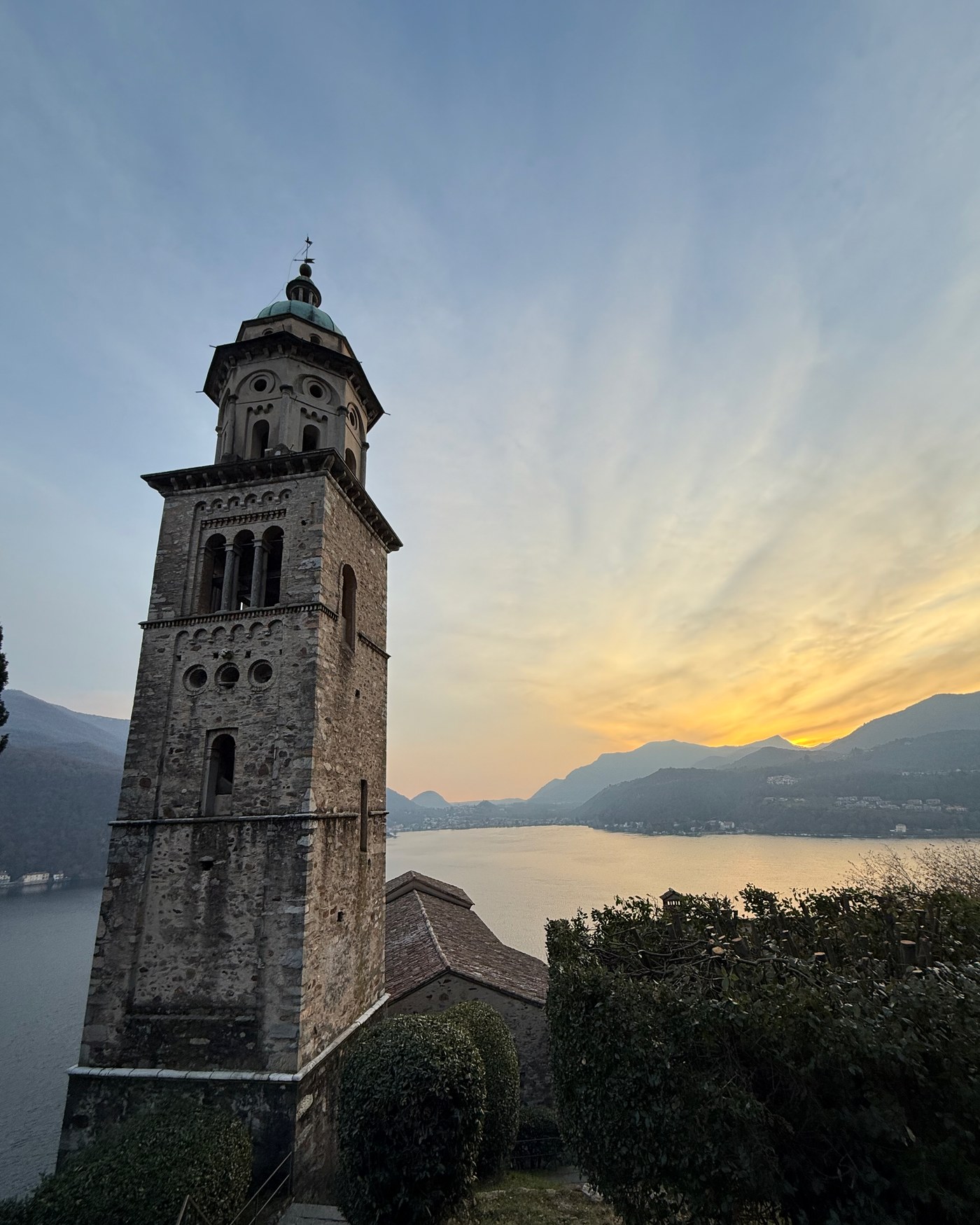 The campanile at Morcote above Lake Lugano at sunset