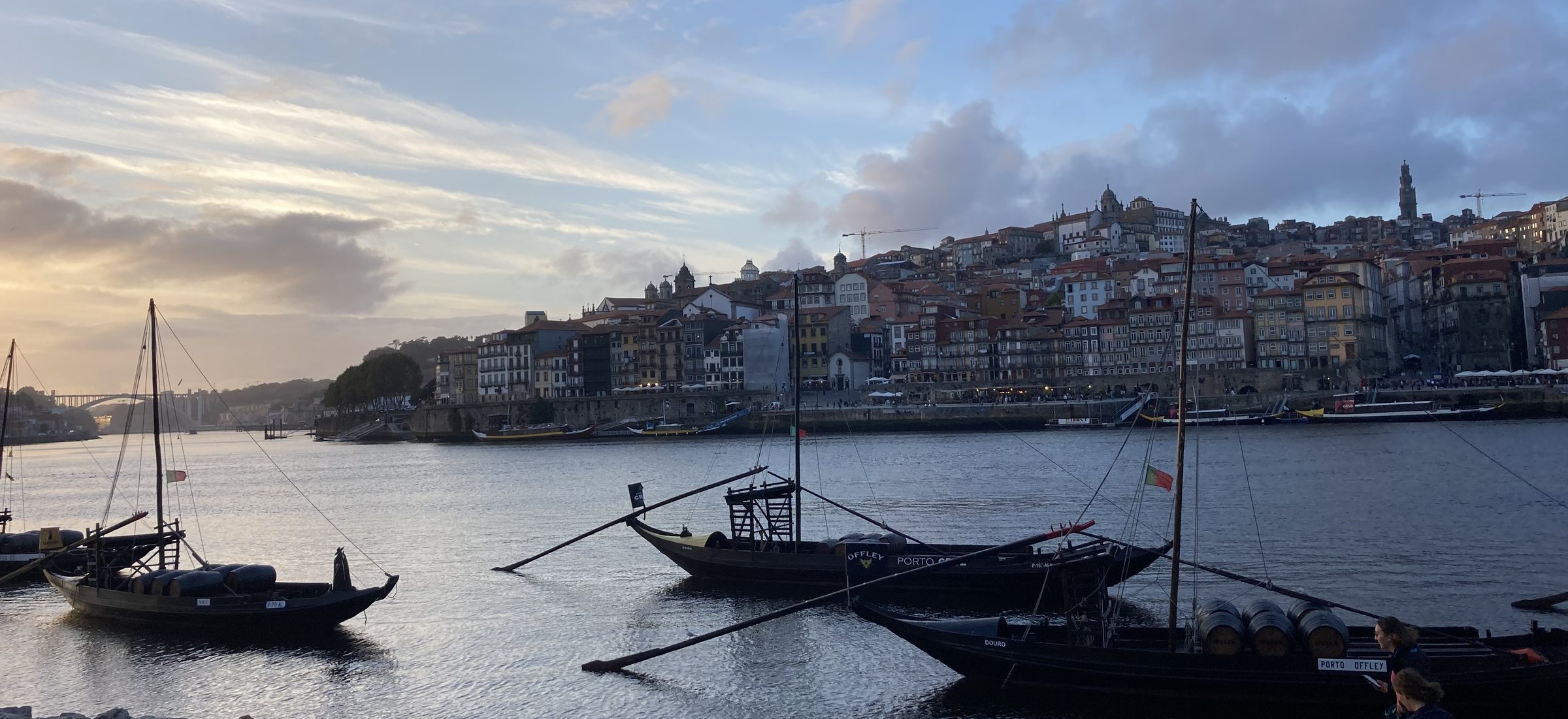 Rabelo boats moored on the Douro with the Ribeira district of Porto beyond